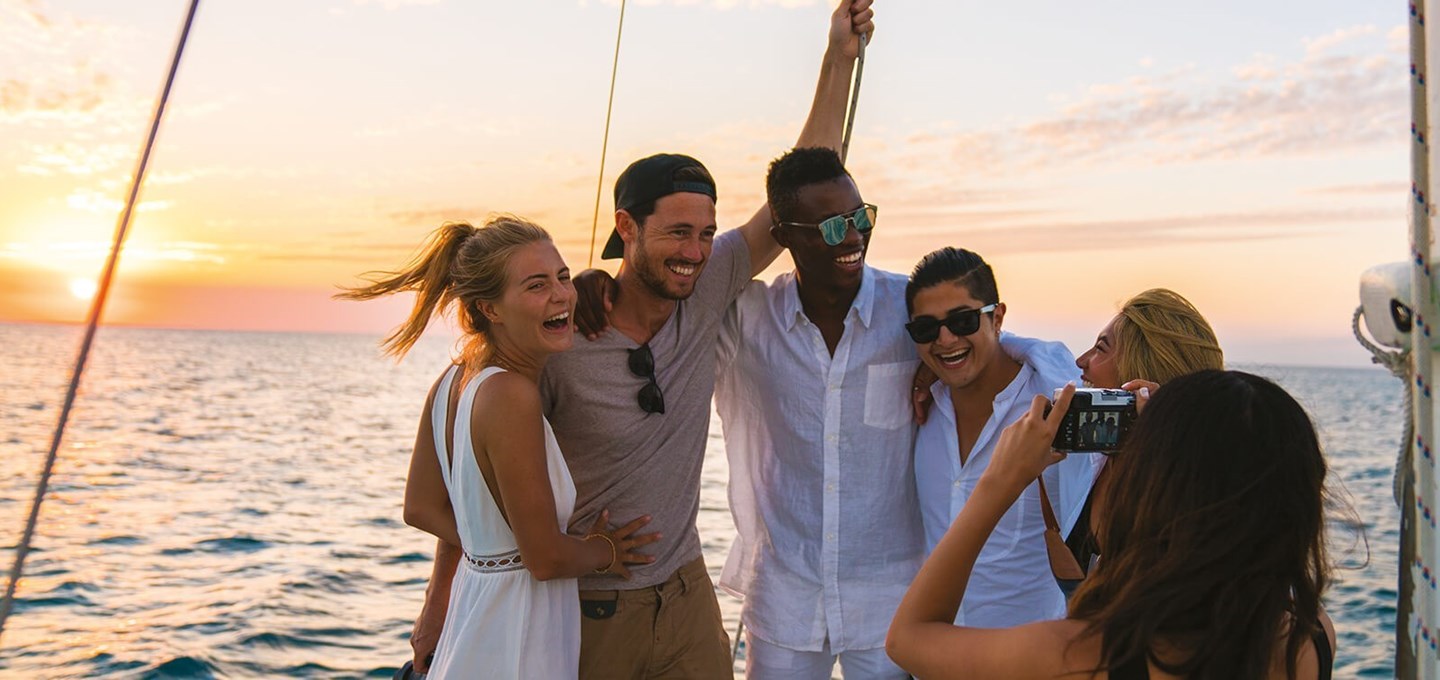 Group of young travellers on a yacht.